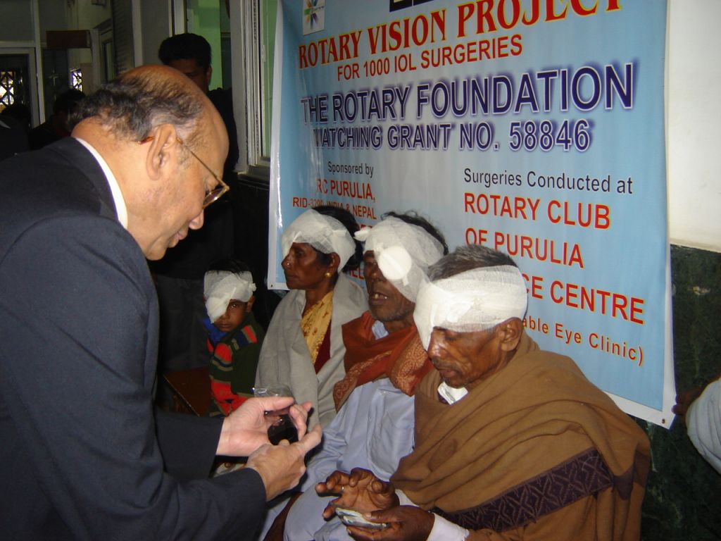 Dr Sam Das dispenses post operative medication to several patients before they are discharged from one of the Rotary Eye Hospitals